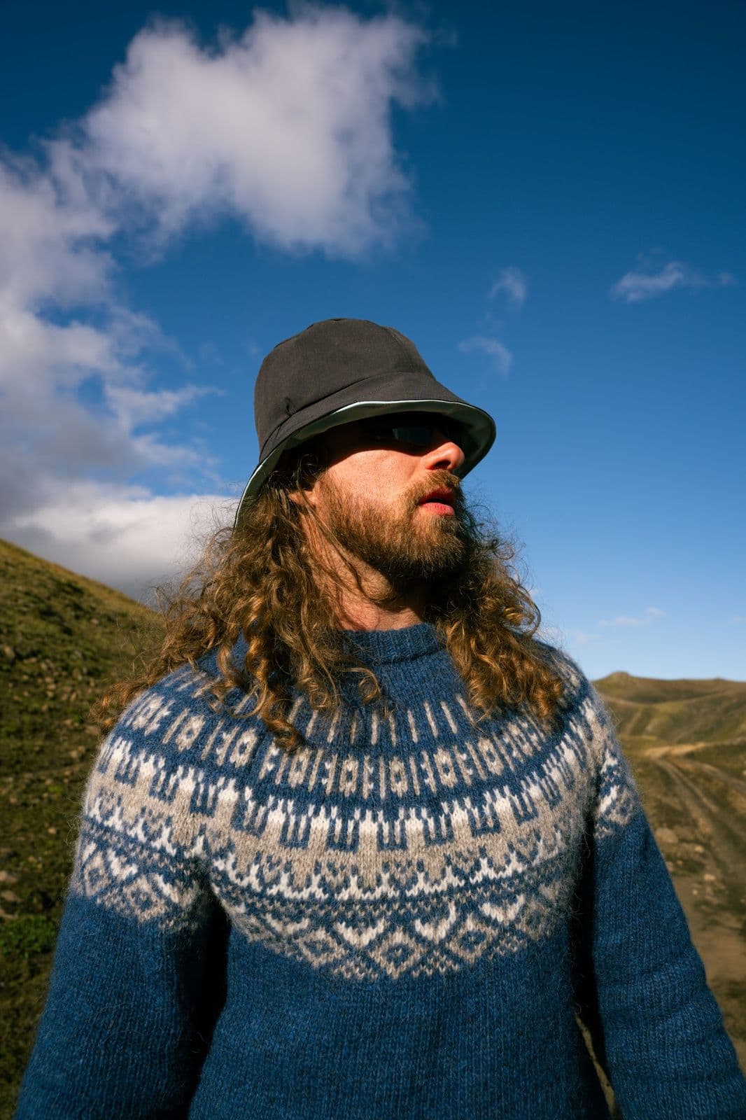 Justin True under a blue Icelandic highland sky, August 2026